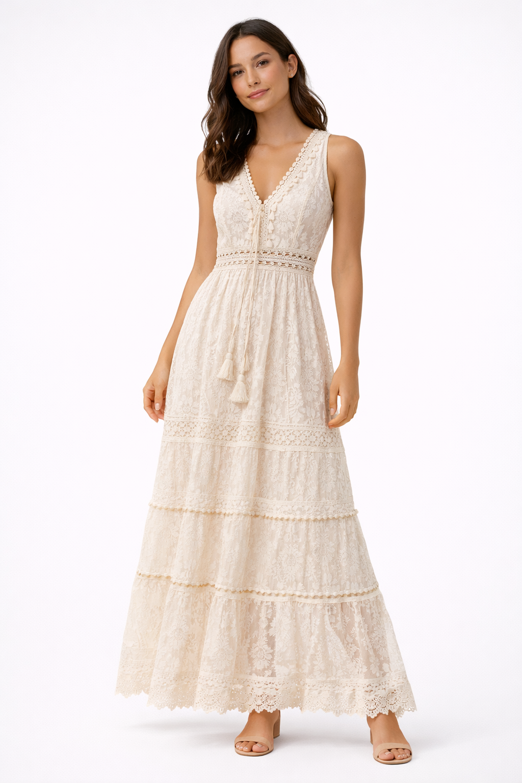 Beige - Sleeveless lace boho maxi dress featuring a V-neckline, crochet-style trims, front tassel ties, and a tiered skirt on a model against a plain background.