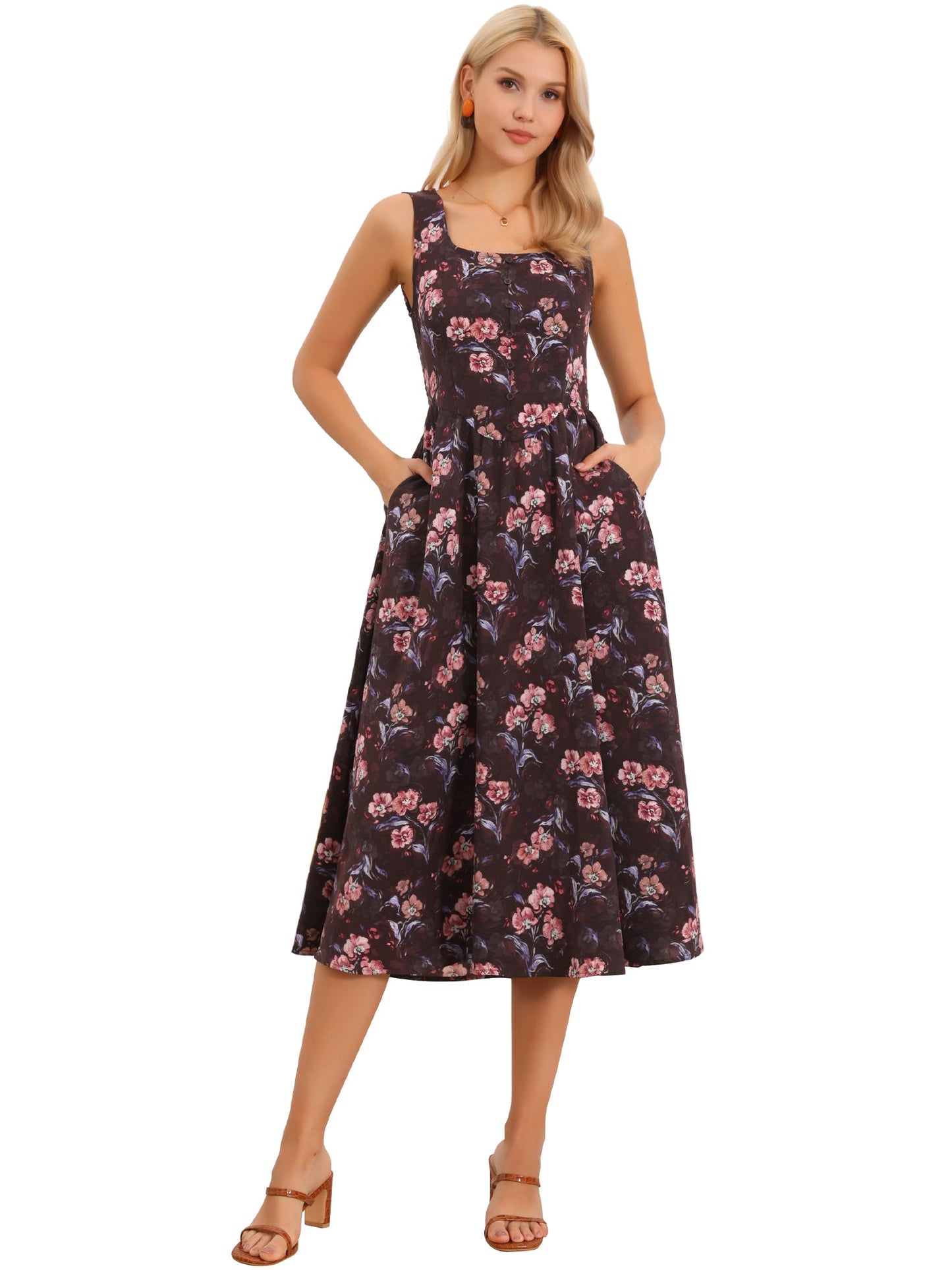 Brown Red Floral - Model wearing a sleeveless floral A-line midi dress with a square neckline and front button detailing, posing in a bright studio setting.