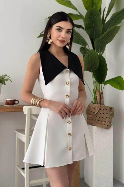White - Women's pale yellow sleeveless mini dress featuring an oversized pointed collar, metallic button-down front, and a structured pleated skirt.