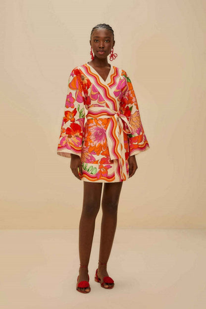 Women's mini wrap dress featuring a vibrant, retro-inspired floral and wavy stripe print, complete with wide kimono sleeves and a self-tie waist belt.