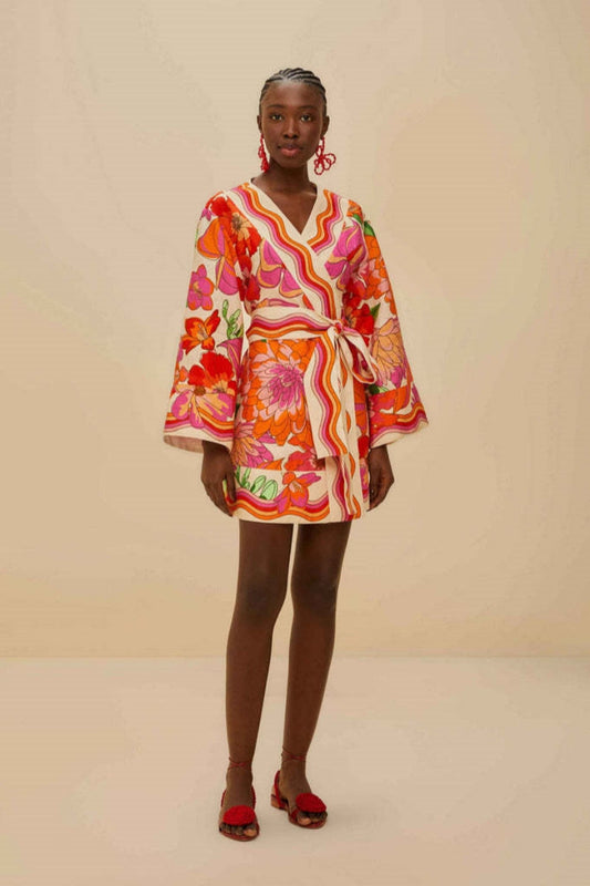 Women's mini wrap dress featuring a vibrant, retro-inspired floral and wavy stripe print, complete with wide kimono sleeves and a self-tie waist belt.