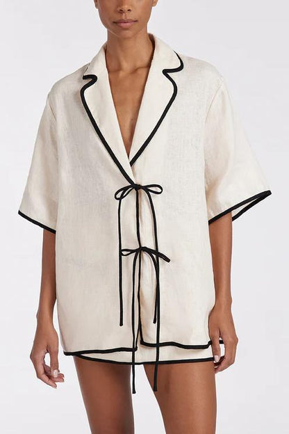 Cream - Women's relaxed fit short-sleeve shirt featuring a notched lapel collar, double tie-front fastening, and dark contrast piping.