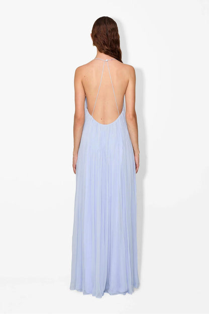 Hydrangea - Front view of a woman modelling a light blue, floor-length pleated maxi dress featuring a V-neckline and thin straps.
