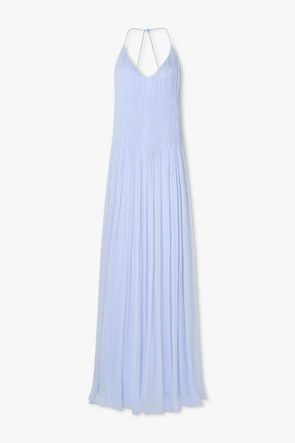 Hydrangea - Front view of a woman modelling a light blue, floor-length pleated maxi dress featuring a V-neckline and thin straps.