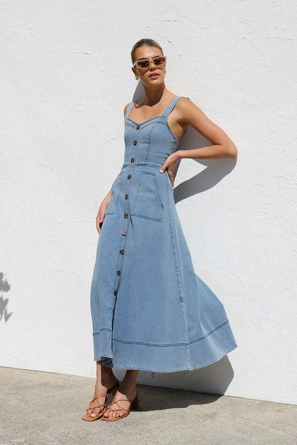 Women's blue structured midi dress featuring a full button-front, wide straps, sweetheart neckline, and front patch pockets.