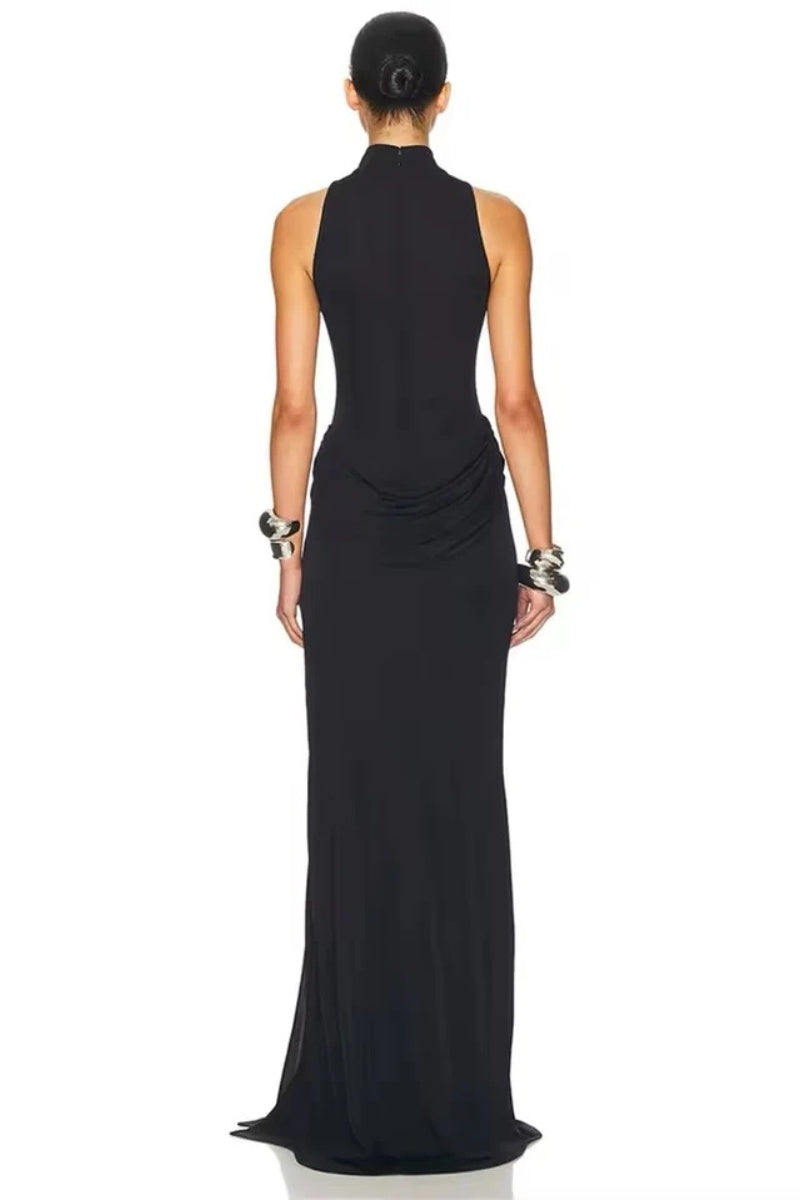 Black - A woman wearing an elegant, floor-length white evening dress featuring a high neckline, sleeveless design, draped hip detailing, and a dramatic thigh-high slit.