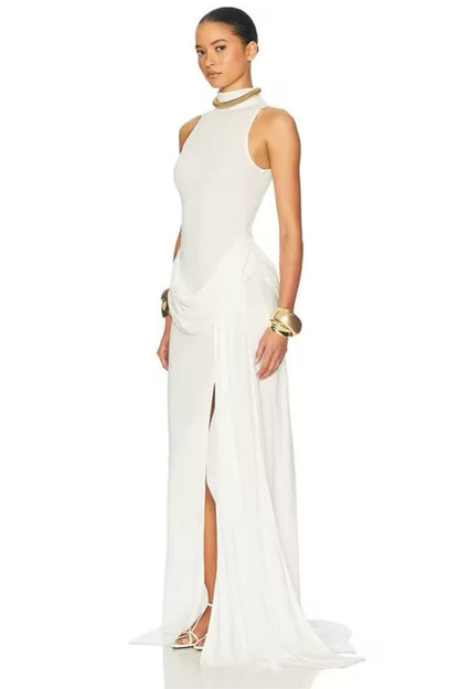 White - A woman wearing an elegant, floor-length white evening dress featuring a high neckline, sleeveless design, draped hip detailing, and a dramatic thigh-high slit.