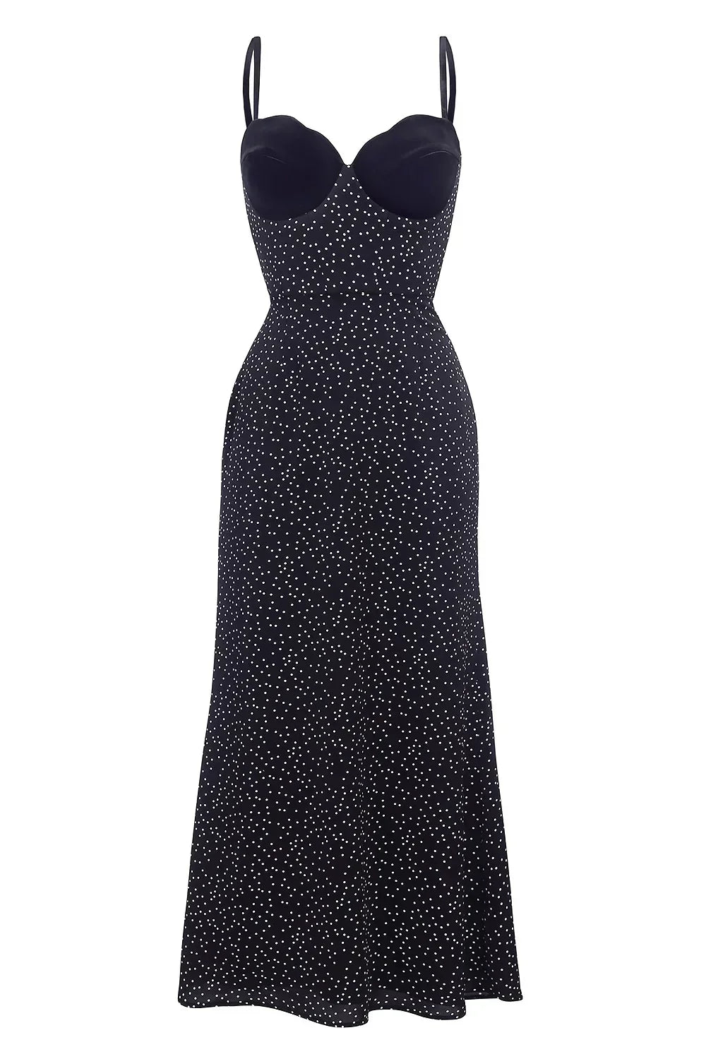 Black - Woman leaning against a white wall wearing a black maxi dress with a solid sweetheart bustier top and white polka dot patterned skirt.