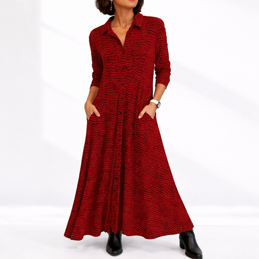 Red - Woman wearing an abstract print collared maxi shirt dress with front buttons and relaxed fit.