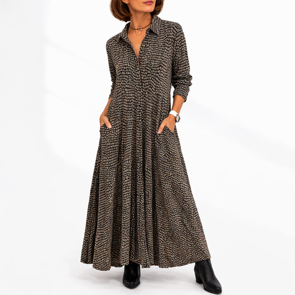Brown/Black - Woman wearing an abstract print collared maxi shirt dress with front buttons and relaxed fit.