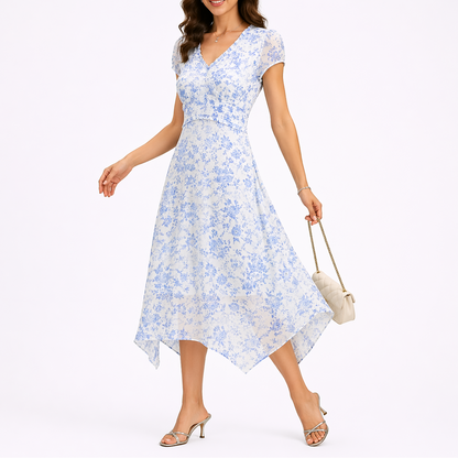 Blue - Woman wearing a floral chiffon V-neck midi dress with cap sleeves and an asymmetric handkerchief hemline.