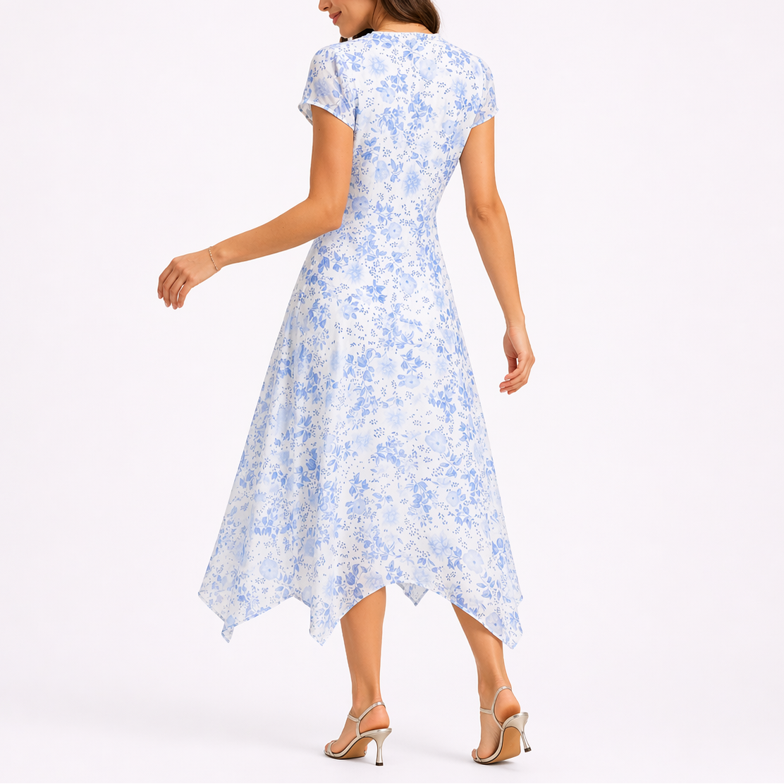 Blue - Woman wearing a floral chiffon V-neck midi dress with cap sleeves and an asymmetric handkerchief hemline.