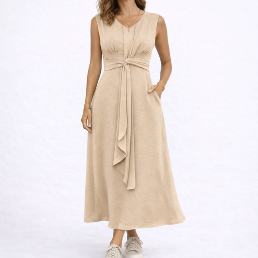 Beige - Sleeveless V-neck midi dress featuring a front knot detail and side pockets, styled with trainers on a white background
