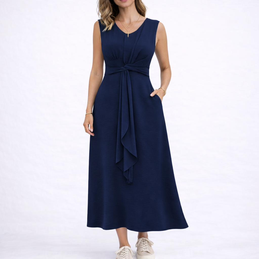 Navy - Sleeveless V-neck midi dress featuring a front knot detail and side pockets, styled with trainers on a white background