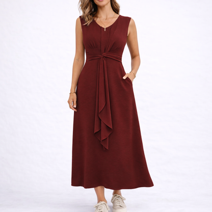 Red - Sleeveless V-neck midi dress featuring a front knot detail and side pockets, styled with trainers on a white background