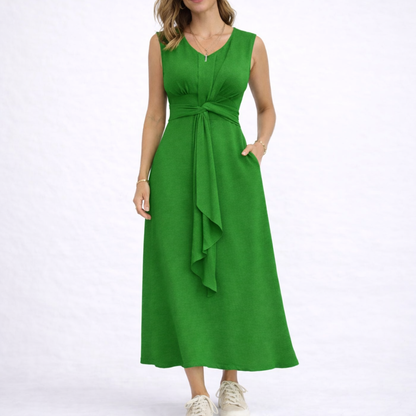Green - Sleeveless V-neck midi dress featuring a front knot detail and side pockets, styled with trainers on a white background