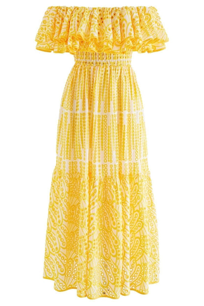 Yellow - A woman wearing a yellow and white off-the-shoulder midi dress featuring a smocked bodice, ruffled neckline, tiered skirt, and intricate broderie anglaise cut-out patterns.