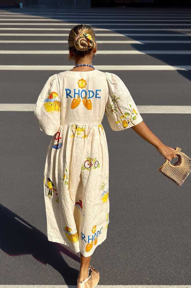 White - Women's cream midi dress featuring a colourful scenic tropical print, V-neckline, button-down front, and short flutter sleeves.