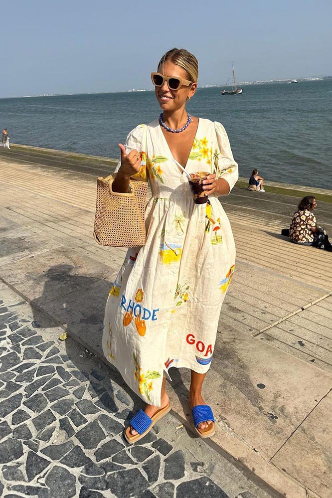 White - Women's cream midi dress featuring a colourful scenic tropical print, V-neckline, button-down front, and short flutter sleeves.
