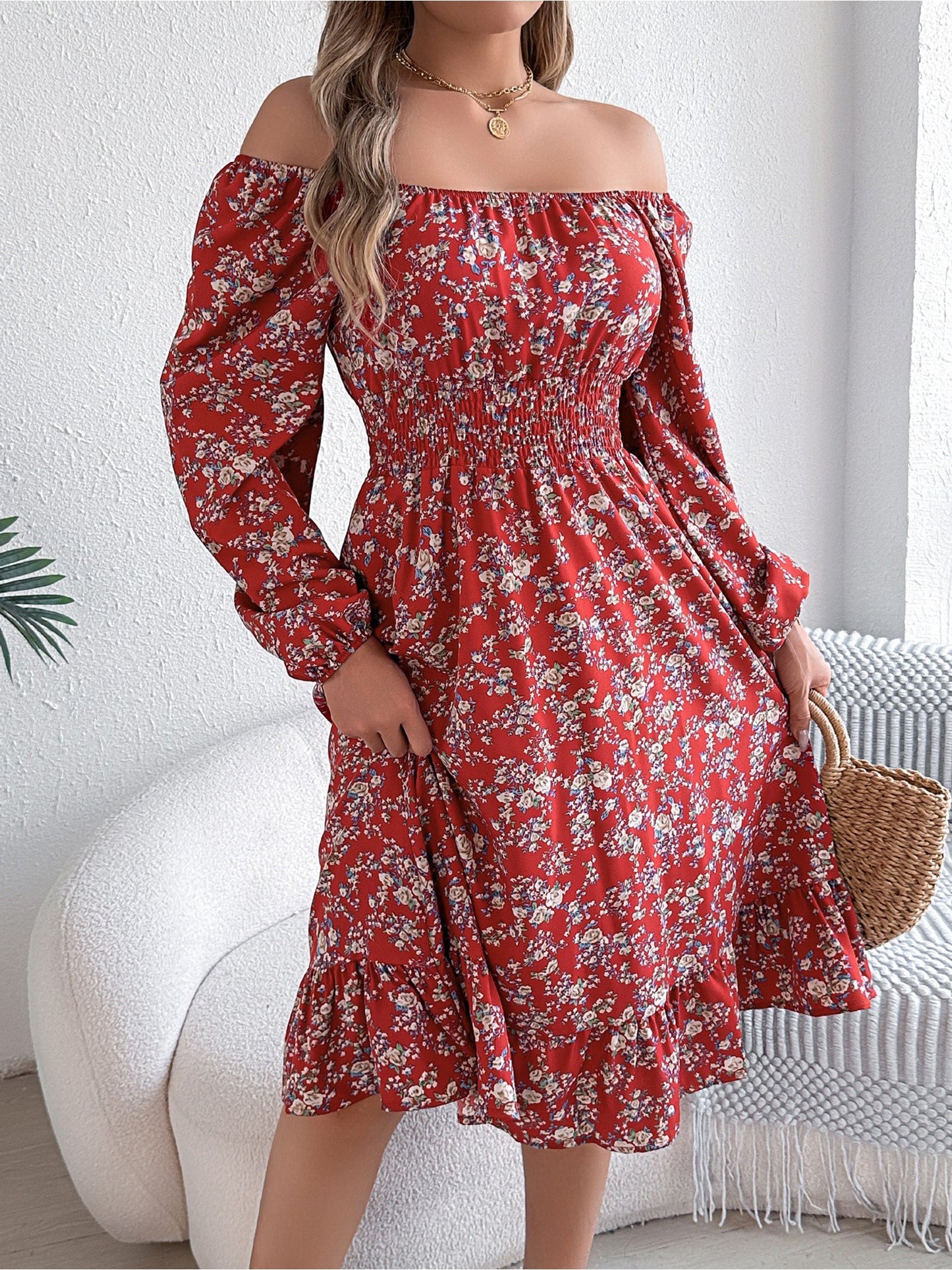 Red - Woman wearing a floral square-neck midi dress with long sleeves, a shirred waist, and a ruffled hem