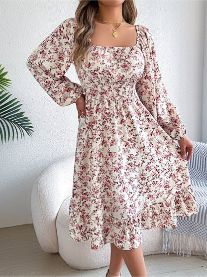 White - Woman wearing a floral square-neck midi dress with long sleeves, a shirred waist, and a ruffled hem