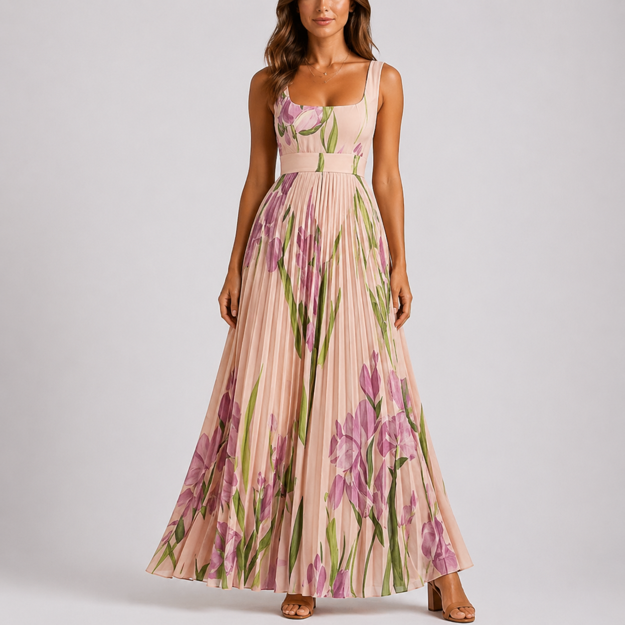 Pink - A woman wearing a floral pleated maxi dress with a square neckline, wide straps, and a flowing A-line skirt.