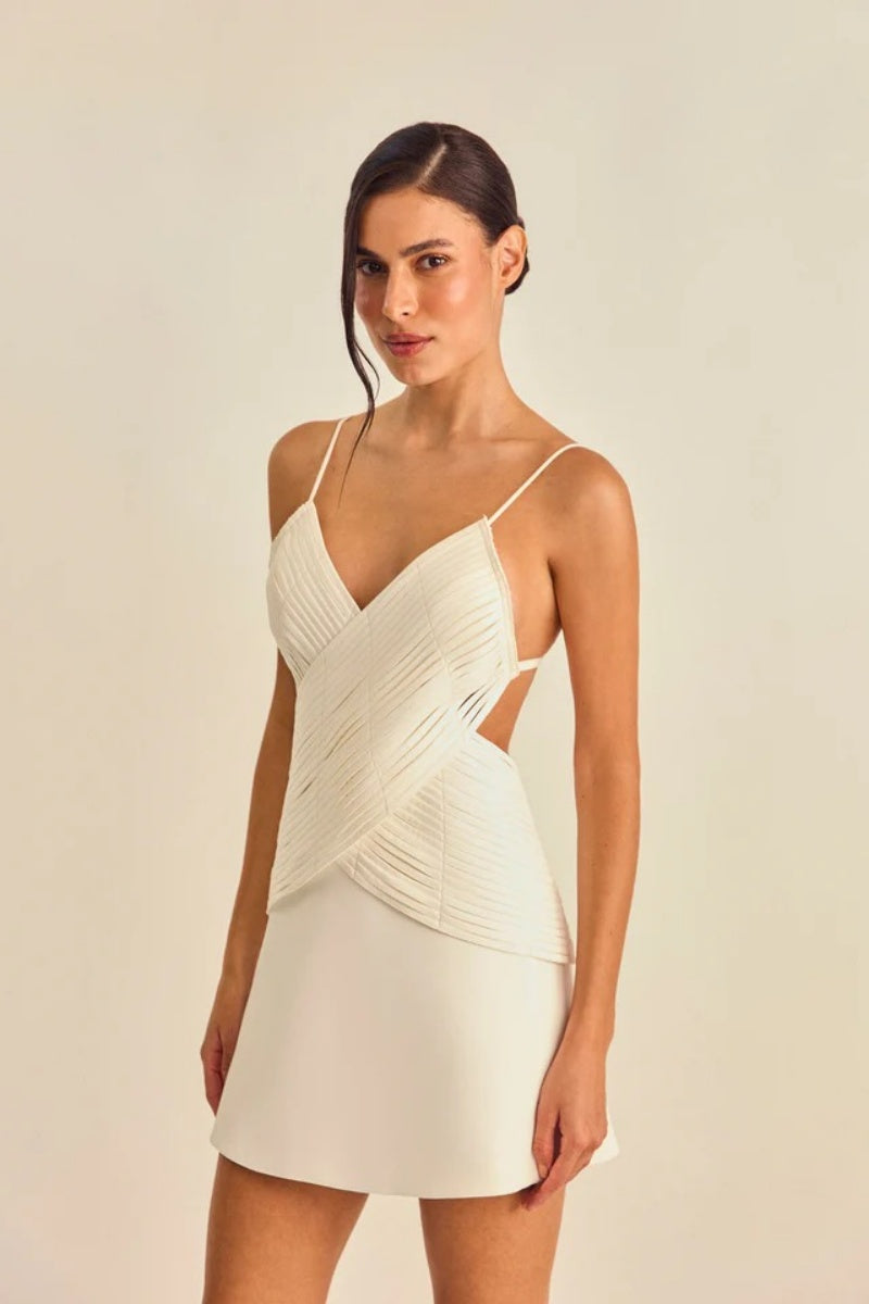 White - Women's cream A-line mini dress featuring a unique criss-cross wrapped bodice with textured banding, a V-neckline, delicate spaghetti straps, and side waist cut-outs.