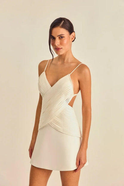 White - Women's cream A-line mini dress featuring a unique criss-cross wrapped bodice with textured banding, a V-neckline, delicate spaghetti straps, and side waist cut-outs.