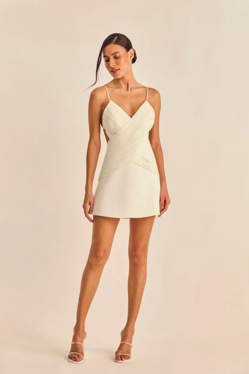 White - Women's cream A-line mini dress featuring a unique criss-cross wrapped bodice with textured banding, a V-neckline, delicate spaghetti straps, and side waist cut-outs.