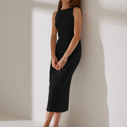 Black - Model wearing a sleeveless plisse midi dress with a high neckline and textured finish against a light grey background.