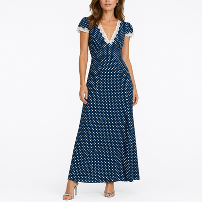 Blue - Woman wearing a long polka-dot maxi dress with lace-trimmed short sleeves and a V-neckline