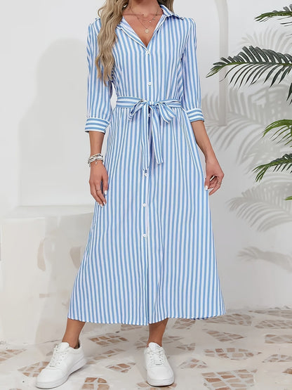 Red - Woman wearing a striped poplin midi shirt dress with 3/4 sleeves, a collared neckline, and a tie waist, styled with white trainers.