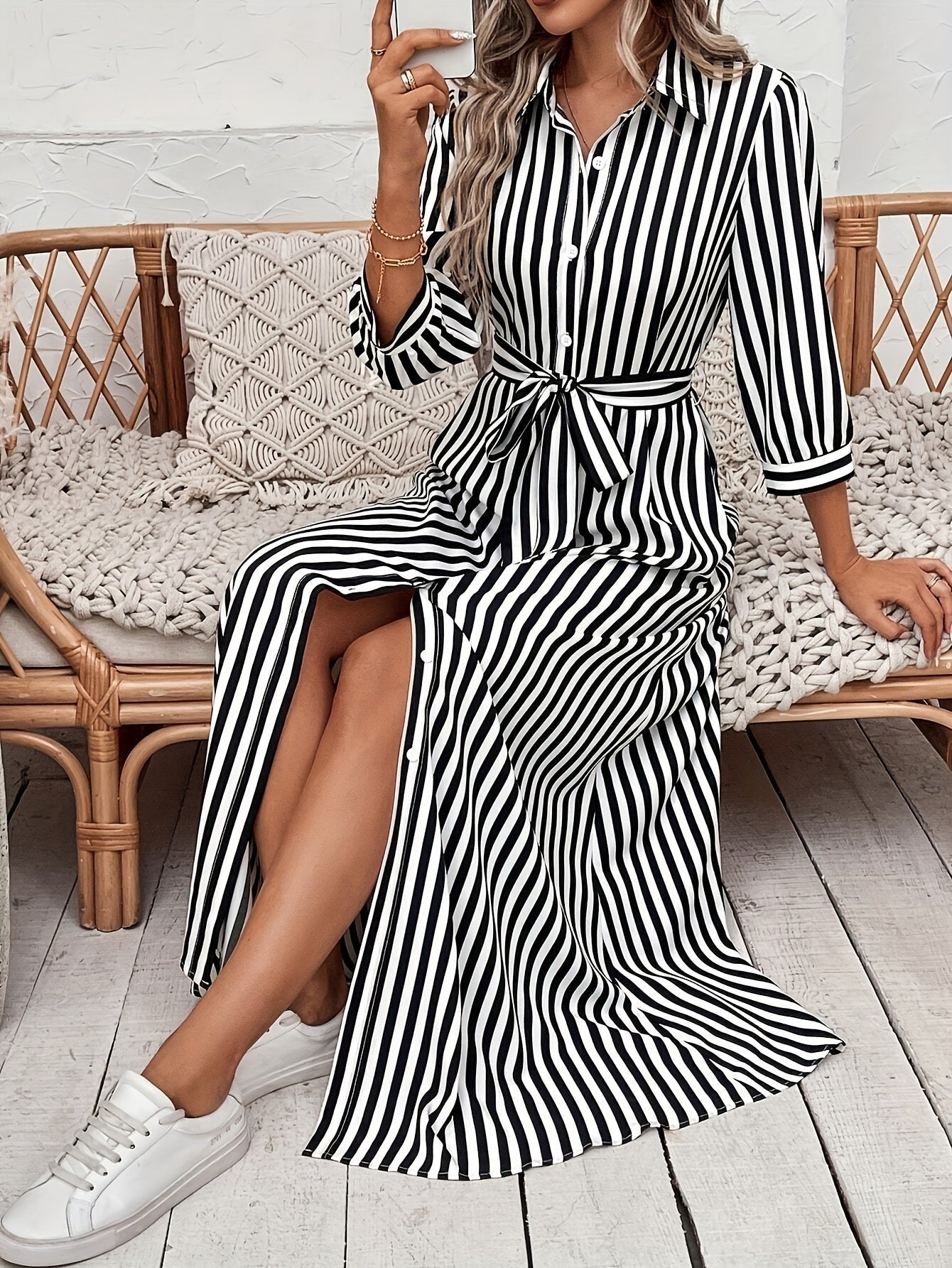Black - Woman wearing a striped poplin midi shirt dress with 3/4 sleeves, a collared neckline, and a tie waist, styled with white trainers.