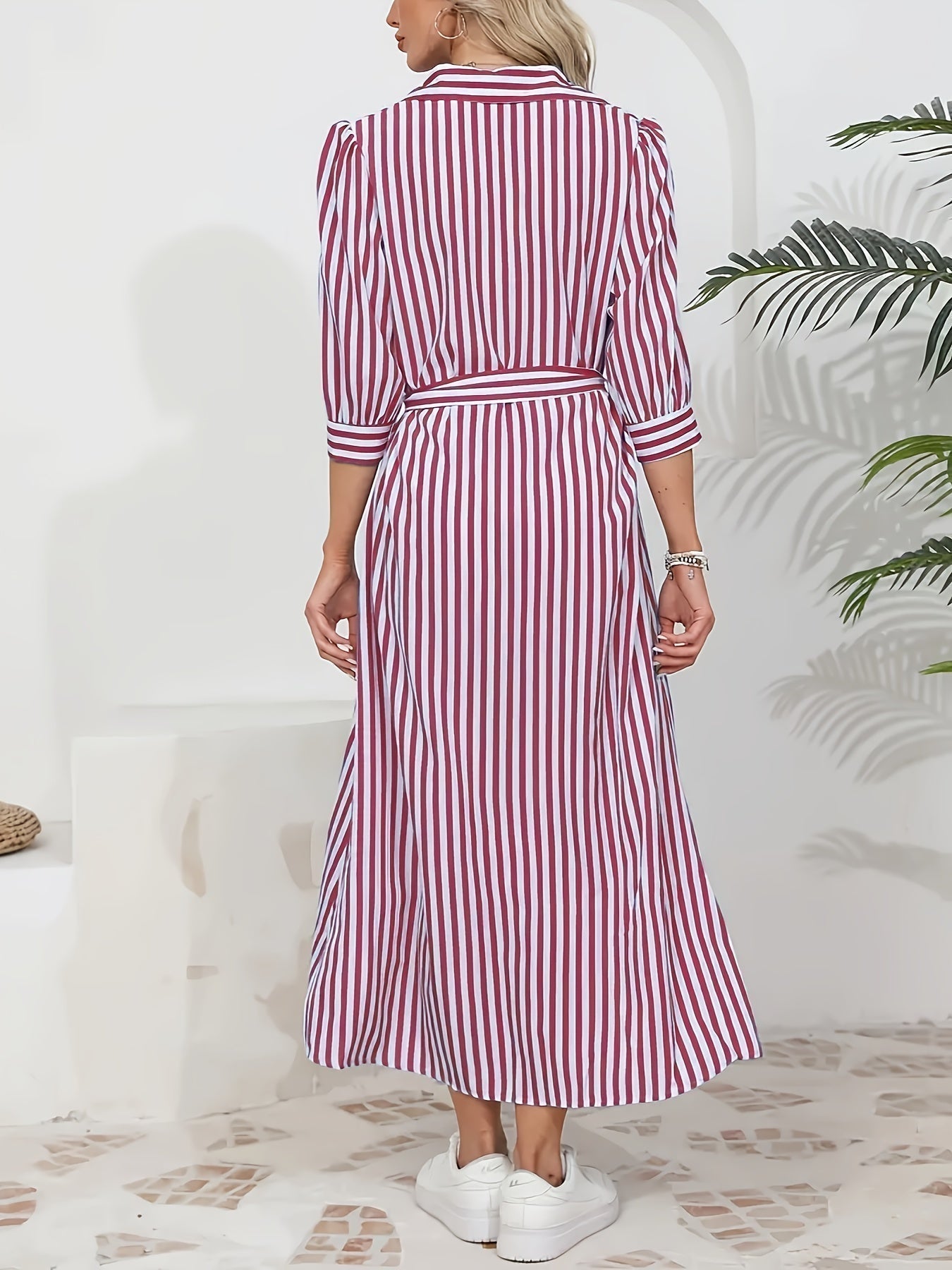 Black - Woman wearing a striped poplin midi shirt dress with 3/4 sleeves, a collared neckline, and a tie waist, styled with white trainers.