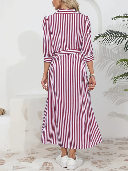 Black - Woman wearing a striped poplin midi shirt dress with 3/4 sleeves, a collared neckline, and a tie waist, styled with white trainers.