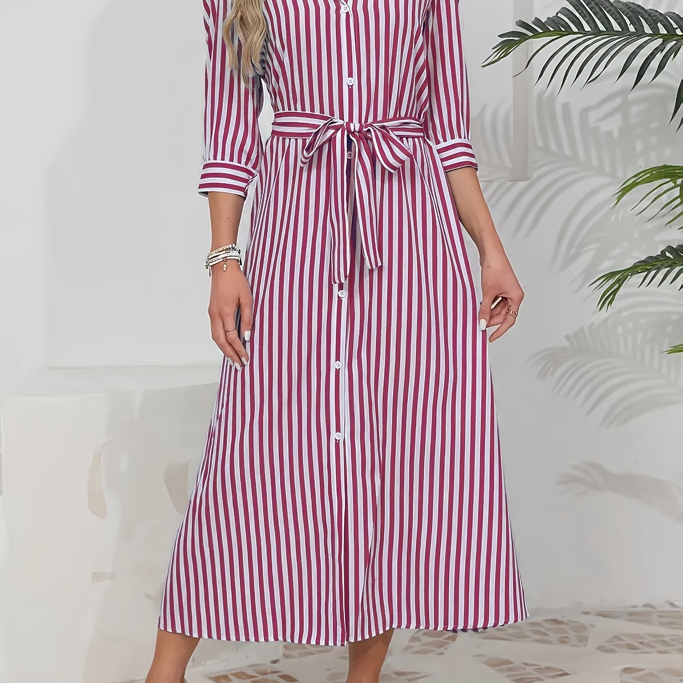 Red - Woman wearing a striped poplin midi shirt dress with 3/4 sleeves, a collared neckline, and a tie waist, styled with white trainers.