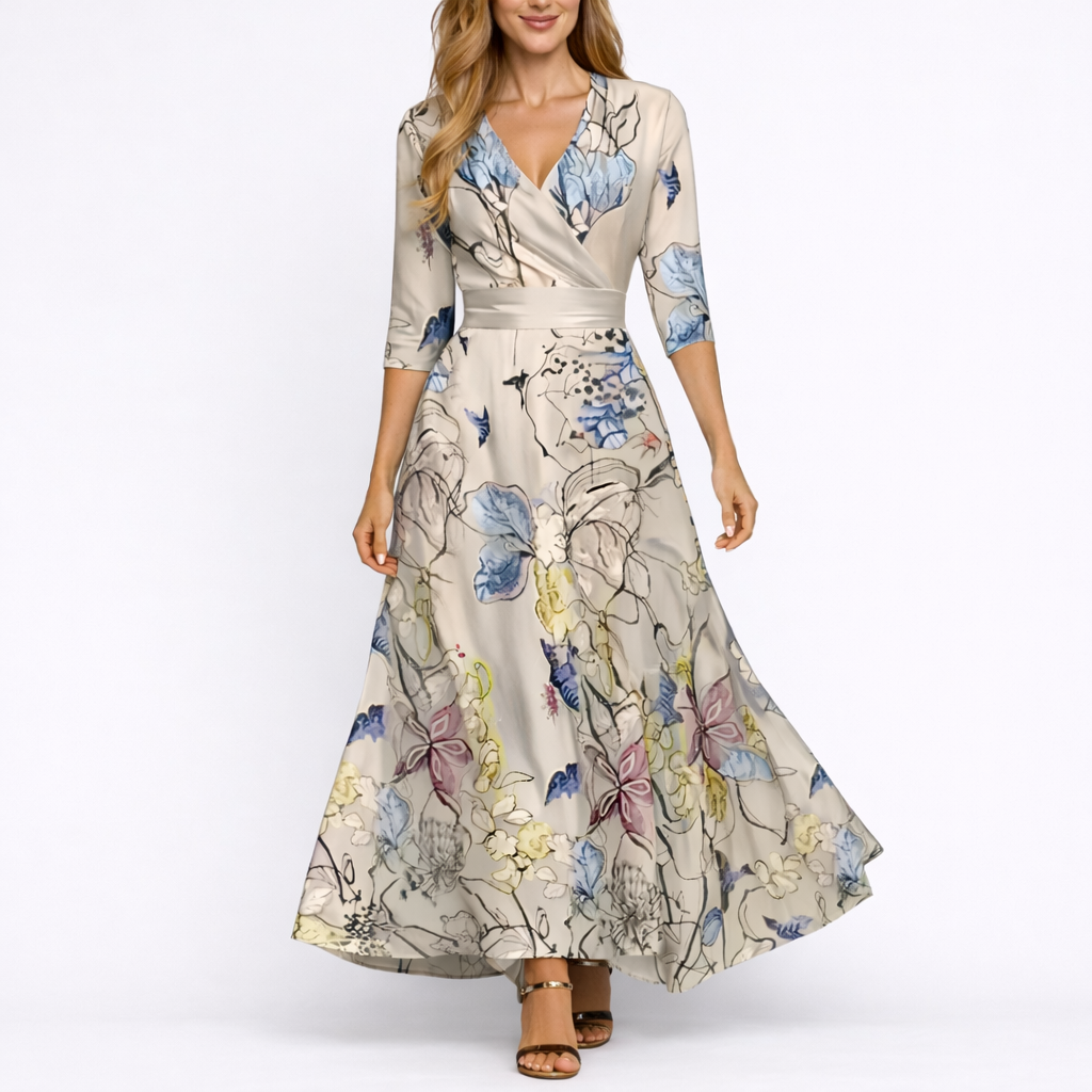 Sand & Beige - Woman wearing a long satin floral maxi dress with 3/4 sleeves, a V-neckline, and a sweeping A-line skirt.