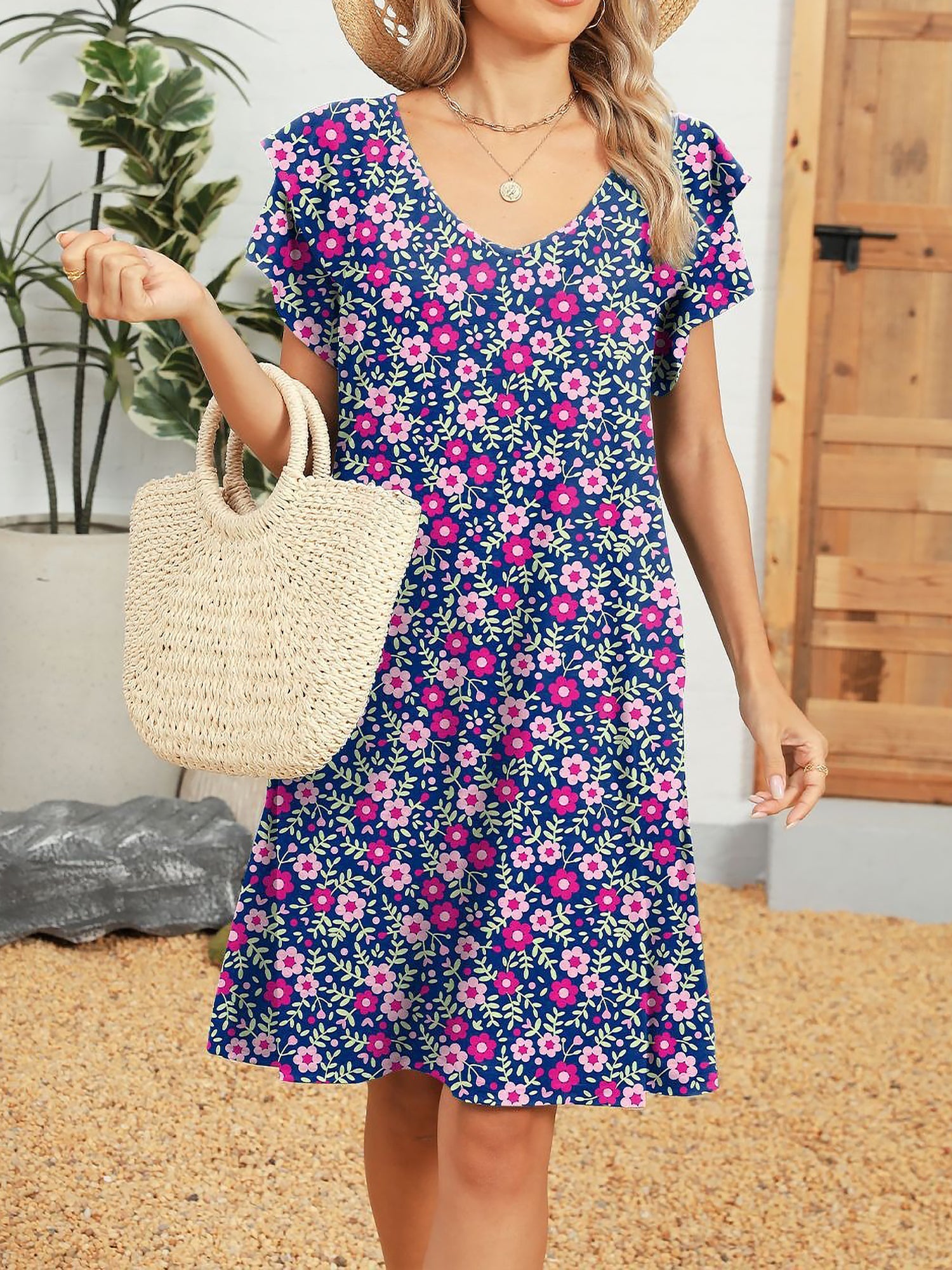 Pink - Woman wearing a lightweight woven animal-print shift dress with a V-neckline and short flutter sleeves, styled with a woven bag.