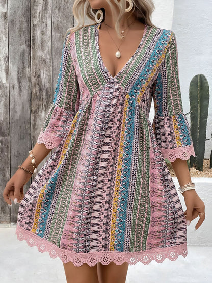 Pink - Woman wearing a patterned V-neck mini dress with 3/4 sleeves and lace trim detailing