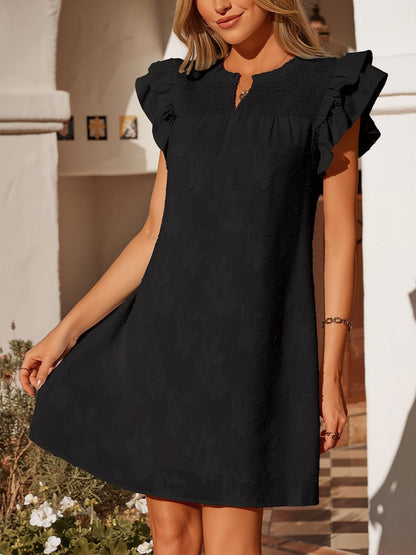 Black - Woman wearing a woven mini dress with a raised floral pattern, ruffle sleeves, and a notch neckline, standing outdoors