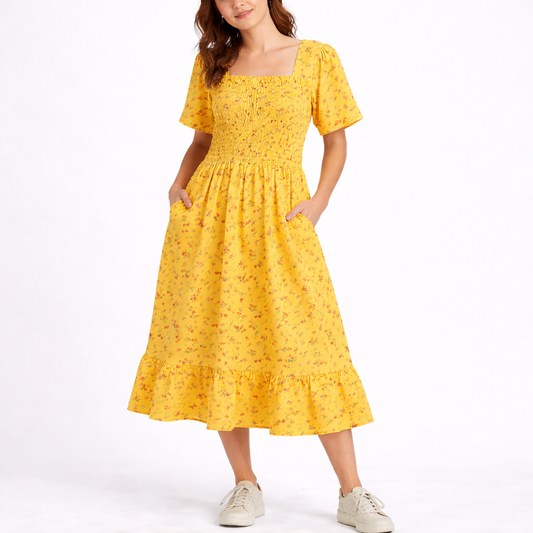 Yellow - Model wearing a woven floral square-neck midi dress with a smocked bodice, short sleeves, and a ruffle hemline.