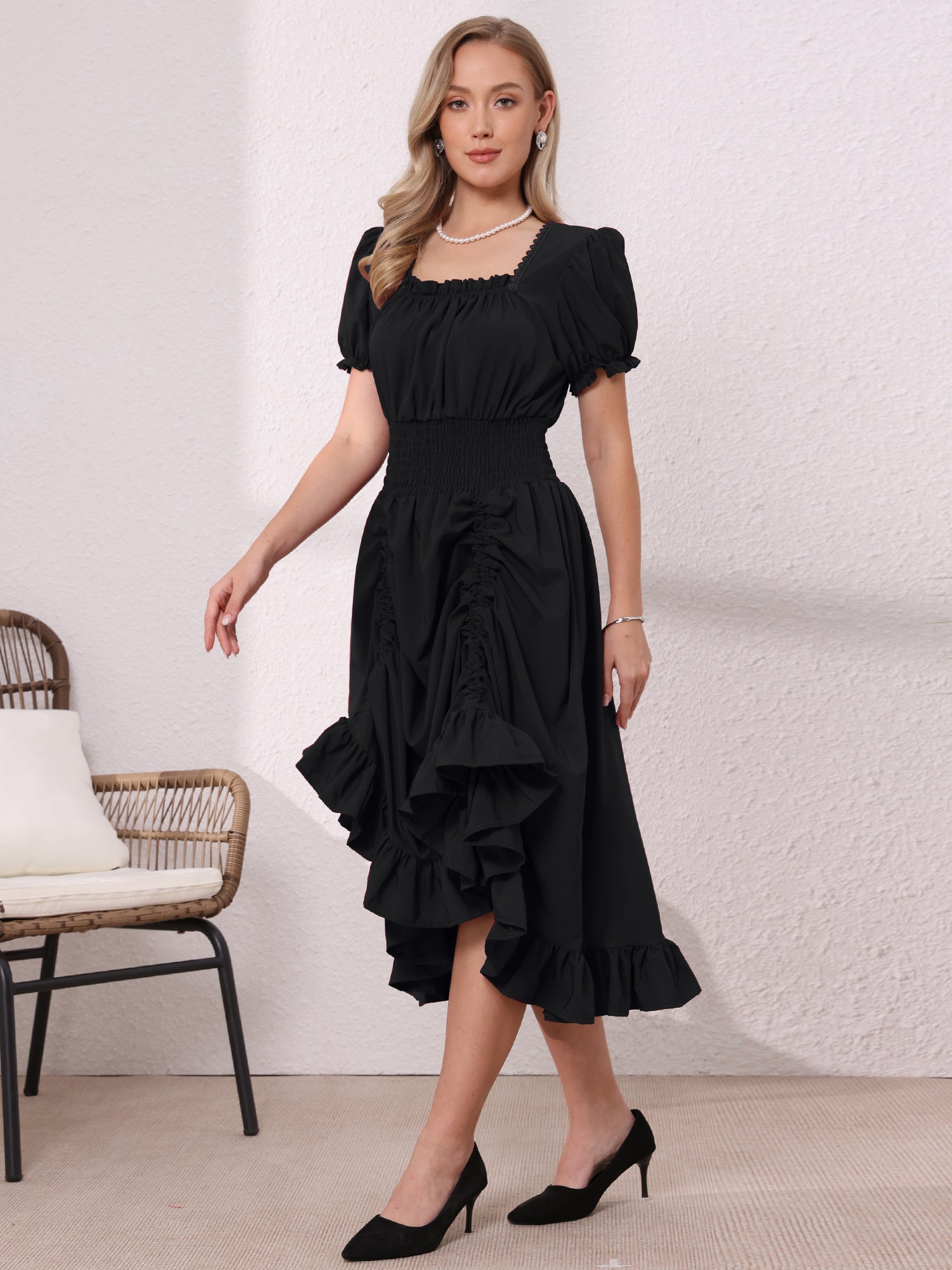 Black - Model wearing a solid woven midi dress featuring a square neckline, short puff sleeves, a wide smocked waist, and a dramatic ruched front with an asymmetrical ruffled hem.