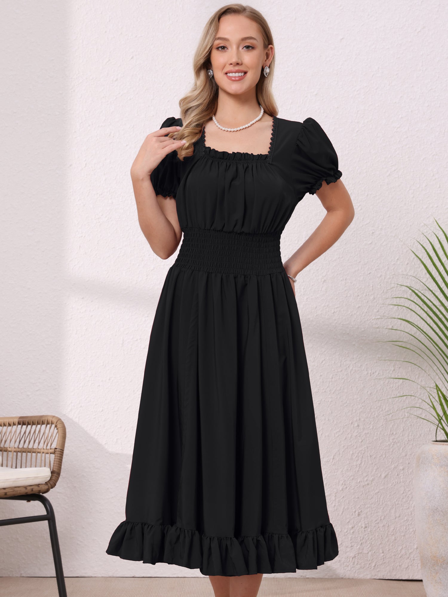 Black - Model wearing a solid woven midi dress featuring a square neckline, short puff sleeves, a wide smocked waist, and a dramatic ruched front with an asymmetrical ruffled hem.
