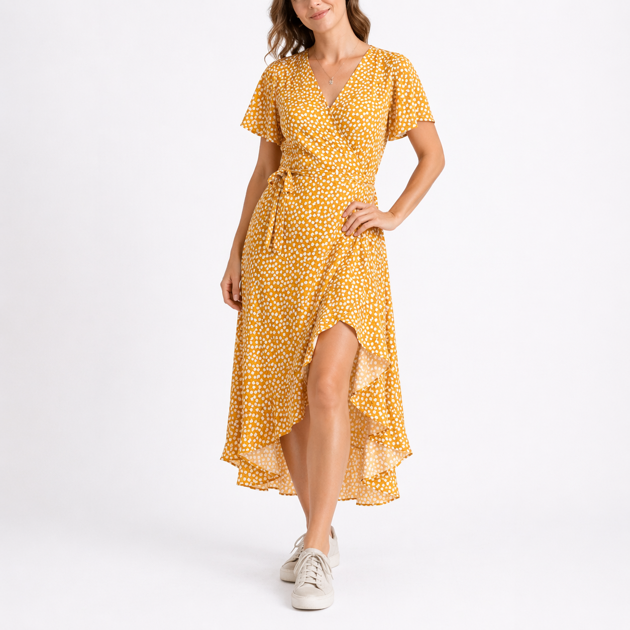 Yellow - Woman wearing a woven spotted wrap midi dress with short sleeves, a tie waist, and a high-low hemline.