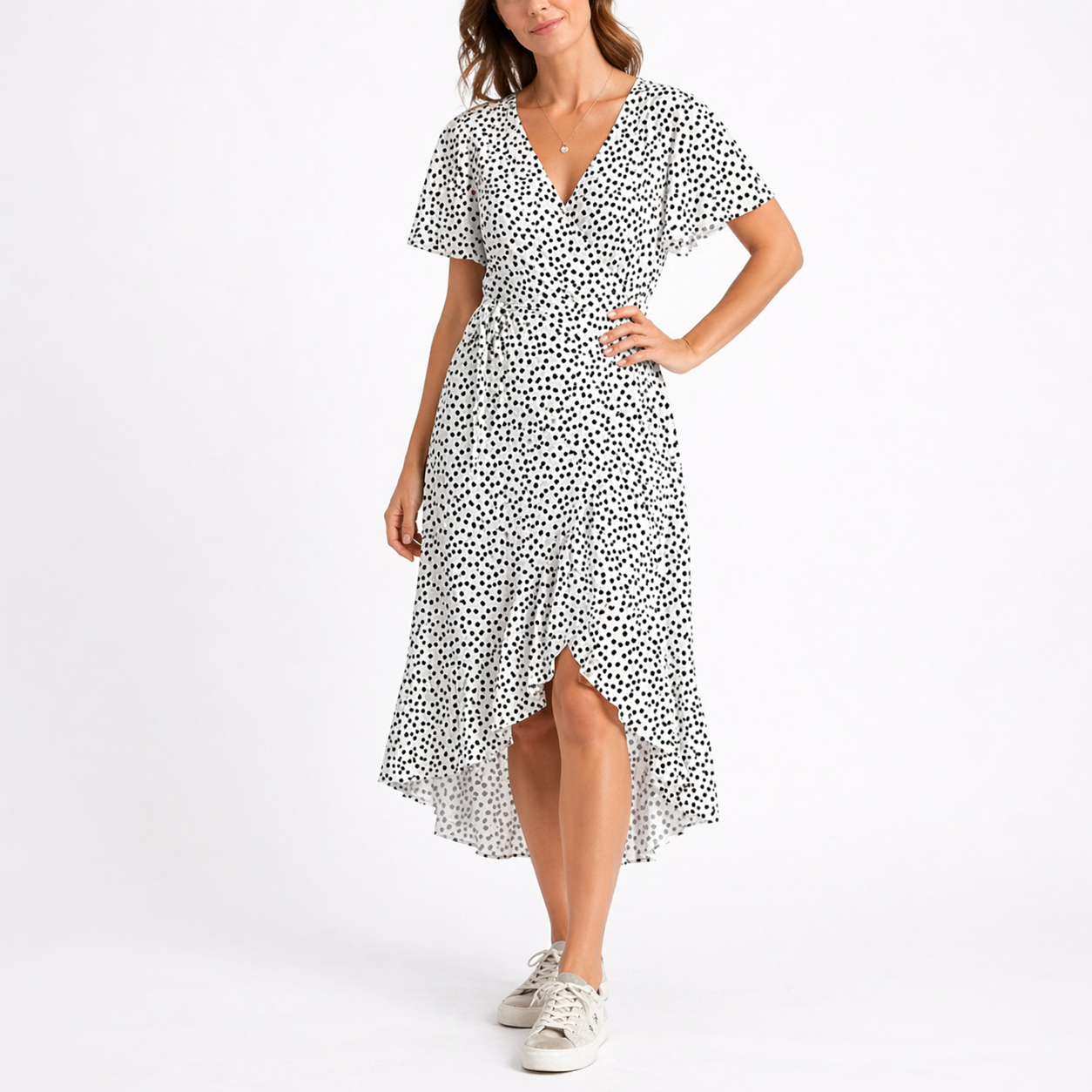 White - Woman wearing a woven spotted wrap midi dress with short sleeves, a tie waist, and a high-low hemline.